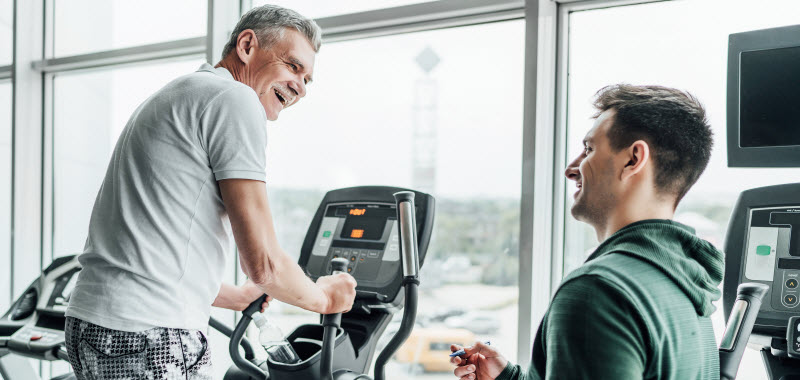 Total Care Rehabilitation - Understanding cardiac rehabilitation Senior man using a treadmill while physiotherapist standing next to him